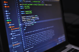 Picture of laptop with programing code